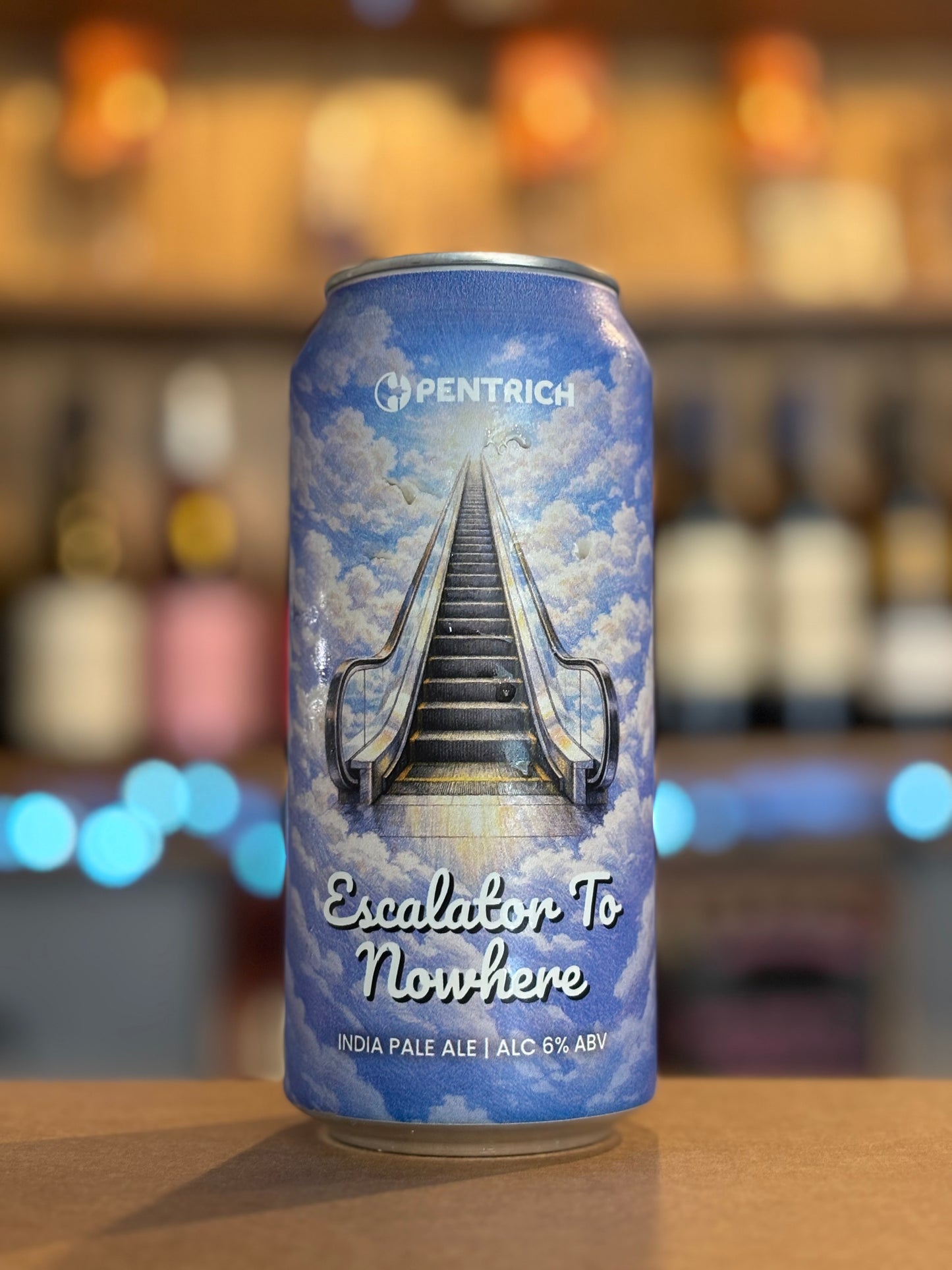 Pentrich 'Escalator To Nowhere' beer can with a blurred bar background